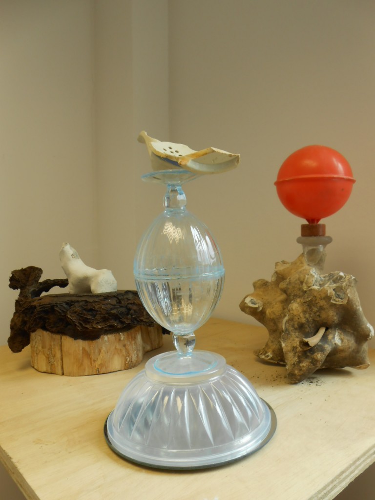 Afterlife of Objects Series - ceramic fragment from Morecambe Bay, flint, plastic  ball-cock, ceramic kiln prop from Thames, glass dessert bowls, plastic jelly container, mirror, bronze, wood (2013)